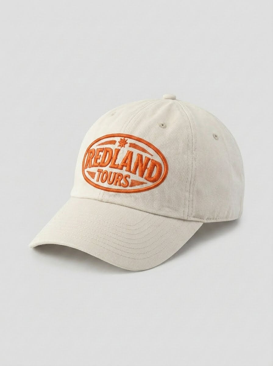 Cappellino beige Redland Tours con logo ovale ricamato arancio.