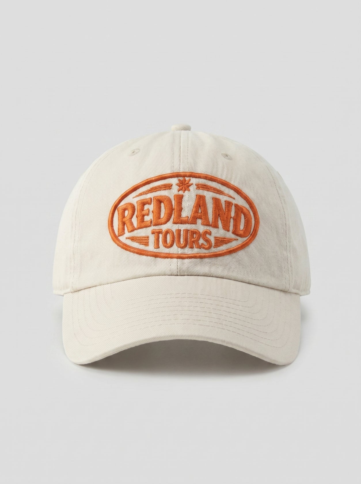 Cappellino beige Redland Tours con logo ovale ricamato arancio.